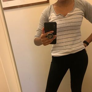 Gray and white striped baseball shirt.